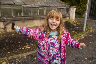 Cute girl standing outdoors