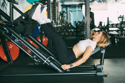 Young woman exercising in gym