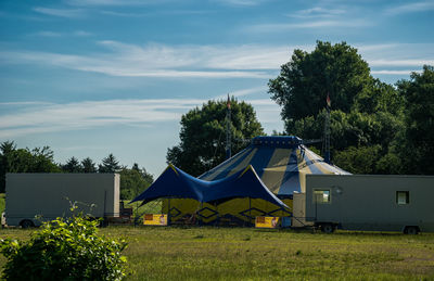 Tent on field against sky