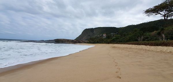 Scenic view of beach against sky