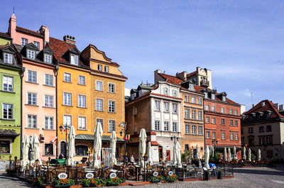 Scenic view of restaurant in town against clear sky