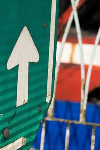 Close-up of multi colored sign on wood