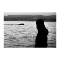 People sitting on boat in sea