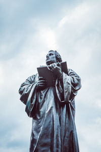 Low angle view of statue against sky