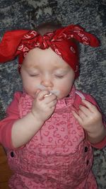 High angle view of cute girl making face