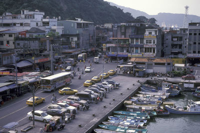 High angle view of harbor by buildings in city