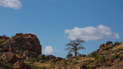 Low angle view of rock formations against sky