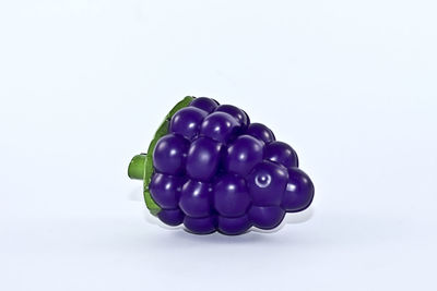 High angle view of multi colored balls on white background