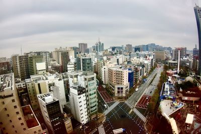 High angle view of modern buildings in city against sky