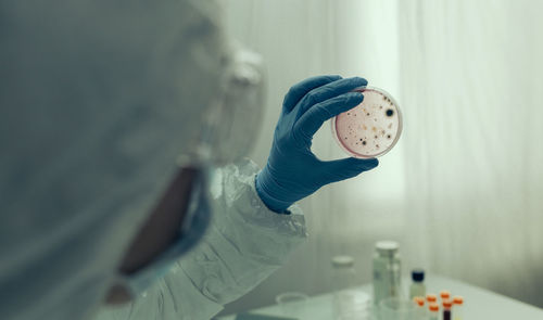 Cropped image of surgeon holding medical sample