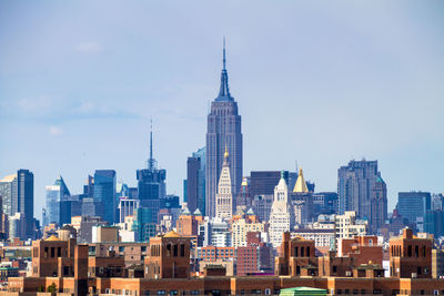 Skyscrapers in city against sky