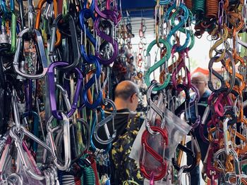 Full length rear view of a man standing in store