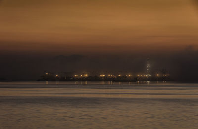 Scenic view of sea against sky at night