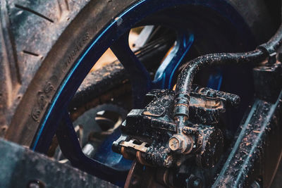 Close-up of rusty machine part of car