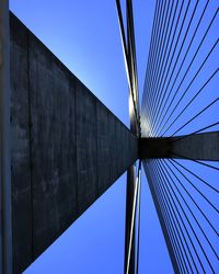 Low angle view of bridge against clear blue sky