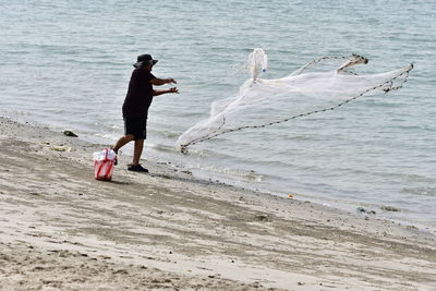 Side view of man on beach