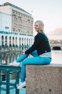 Woman sitting in a city