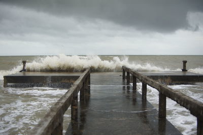 Pier over sea against sky