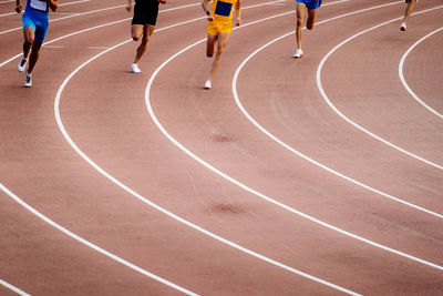 High angle view of people walking on road