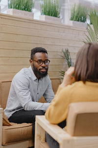 Man attending psychotherapy session at clinic