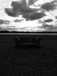 Built structure on field against sky