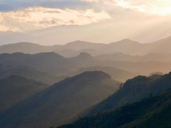 Scenic view of mountains against sky during sunset