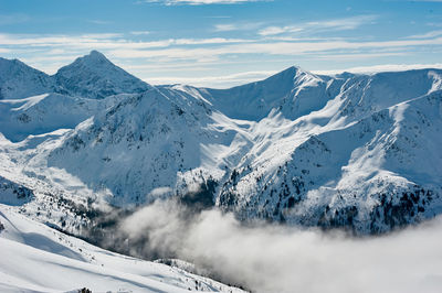 Scenic view of snow mountains against sky