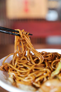 Close-up of noodles in plate on table