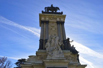 Low angle view of statue against sky