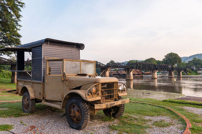 Old american army jeep suv car monument at river kwai bridge in kanchanaburi, thailand