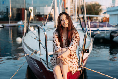 Portrait of young woman in boat