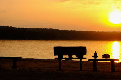 Scenic view of lake against sky during sunset
