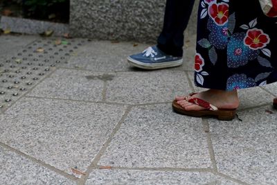 Low section of woman walking outdoors