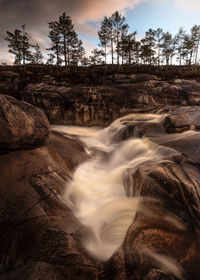 Scenic view of stream against sky