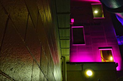 Low angle view of illuminated building at night