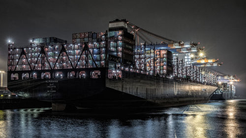 Container ships at harbor during night