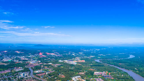 High angle view of townscape against blue sky