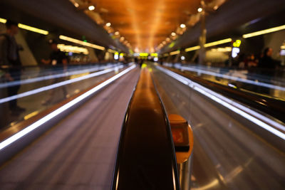 Light trails on escalator in airport