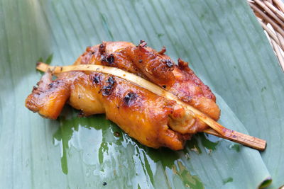 High angle view of meat on barbecue grill