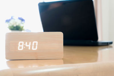 Close-up of information sign on table