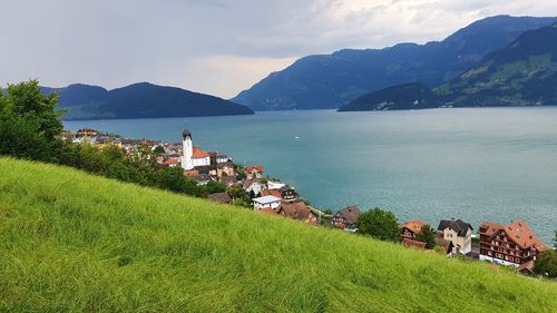 Scenic view of sea and buildings against sky