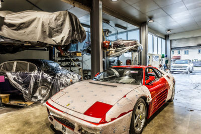 View of red car in garage