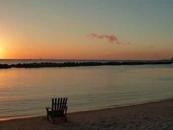 Scenic view of calm sea at sunset