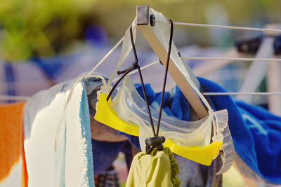 Close-up of clothes hanging on rope