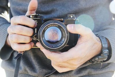 Midsection of man photographing