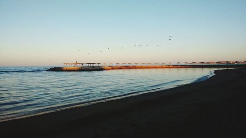 Scenic view of sea against sky at sunset