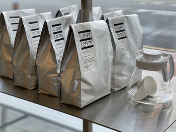 Close-up of coffee bean package on a metal table