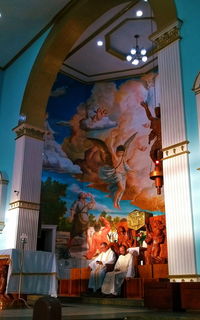 Low angle view of illuminated statue against building