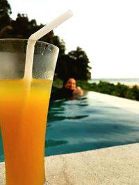 Close-up of drink in swimming pool