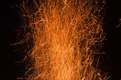 Close-up of firework display at night